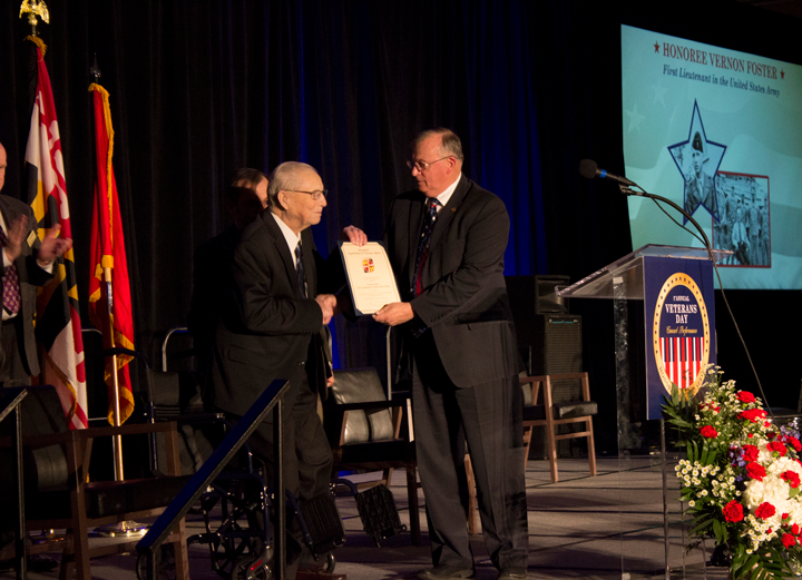 honoree receiving award from Veterans Affairs official